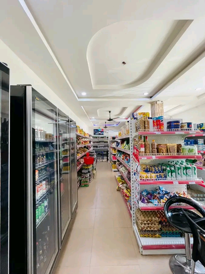 Interior of a Tony K Investment LTD retail store, showing stocked shelves
